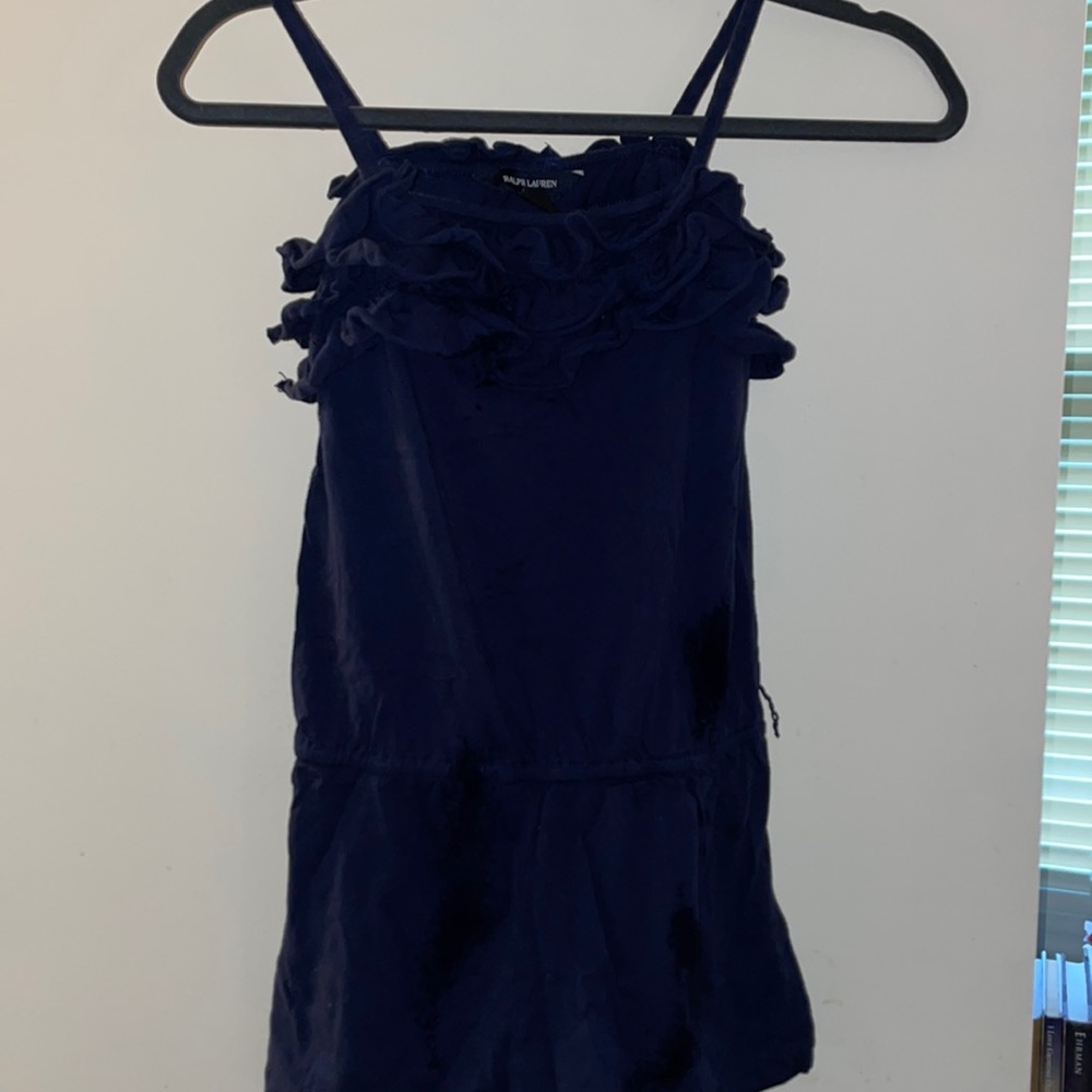 Navy romper with ruffled neckline. Elastic waistband and spaghetti straps
